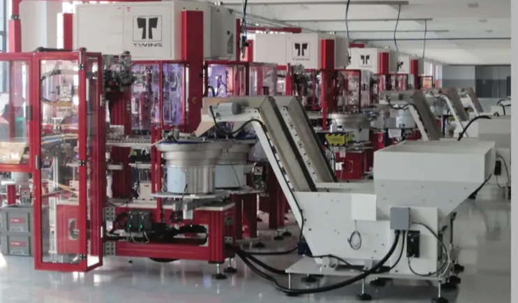 Automated assembly line of TWINS machines with bowl feeder and conveyor