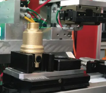 Brass valve body held in an assembly nest
