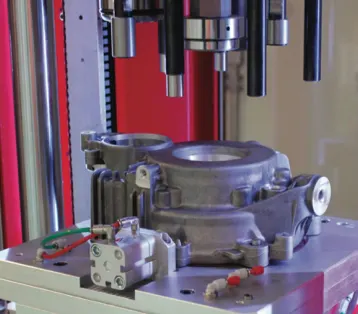 Aluminium casting fixed in a leak test fixture